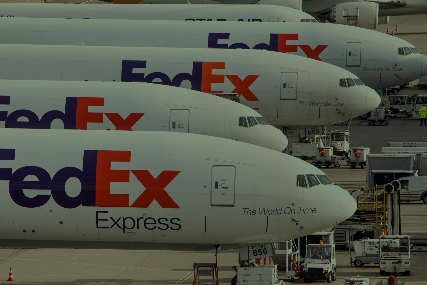 FedEx planes lined up on airport runway